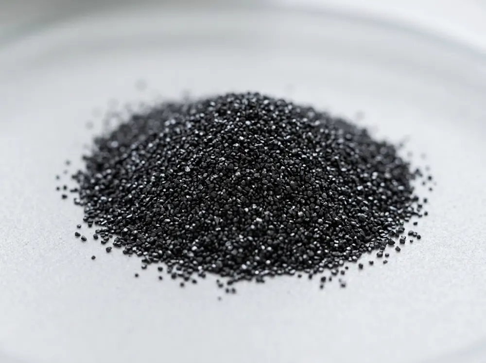 Ilmenite concentrate — black mineral sand close-up